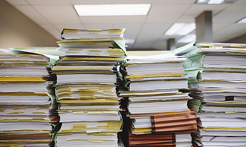 Stacks of Folders and Papers