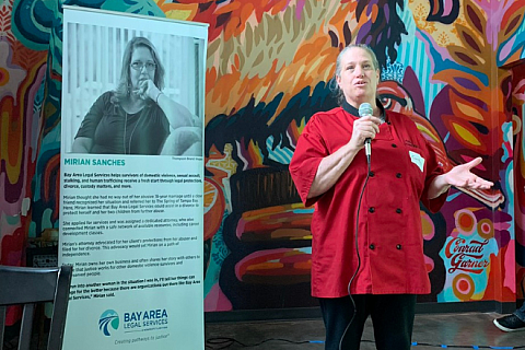 Courtney speaking at an event