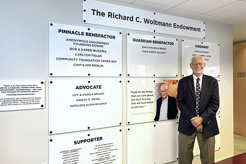 Dick Woltmann with Endowment Wall
