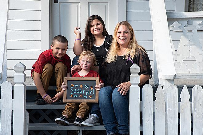 The Paul Family sitting on a porch